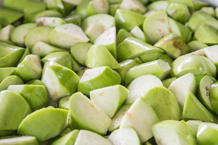 Chopped eggplants are ready to cook and soaking in the water.の写真素材