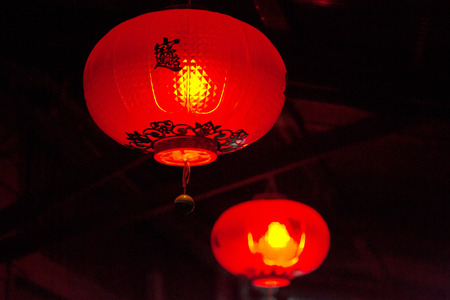 Red chinese lamps are glowing in the dark.の写真素材