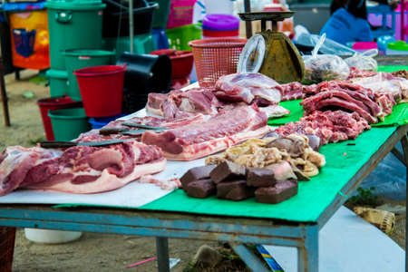 Pork shop in Thai urban village market on March 6, 2014 in Nakornsrithammarat, Thailand.のeditorial素材