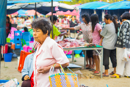 People shopping in Thai urban village market on March 6, 2014 in Nakornsrithammarat, Thailand.のeditorial素材