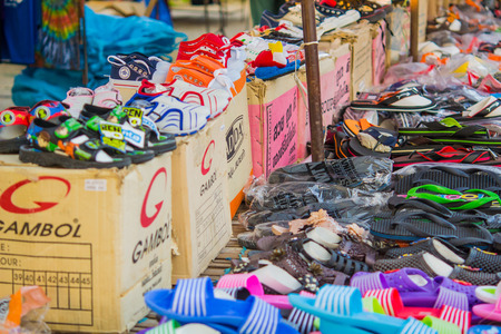 Sandals shop in Thai urban village market on March 6, 2014 in Nakornsrithammarat, Thailand.のeditorial素材
