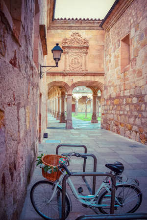 Courtyard of the University of Salamanca with student bike in the foreground, Spainの写真素材