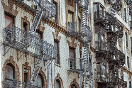 Old apartment facades, with fire stairs. Soho, Manhattan. NYCの写真素材