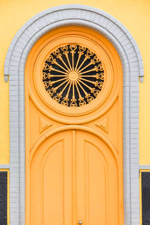 Colorful yellow door of the Alfama neighborhood. Lisbon, Portugal. Europe.の写真素材