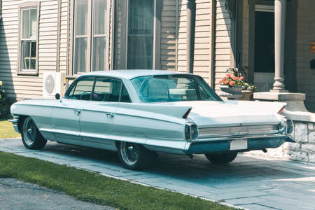 Classic car parked outside of the house. Pastel vintage colors. Canadaの写真素材