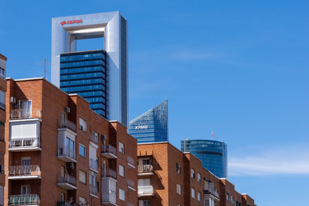 MADRID, SPAIN - MAY 12, 2019: Contrast between the modern towers of Madrid's financial district and the surrounding older residential buildings.のeditorial素材