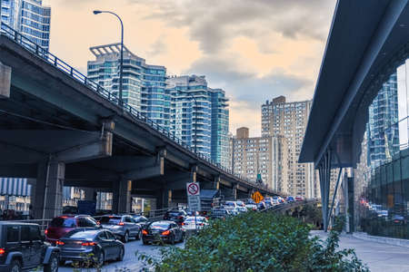 Car traffic jam at the entrance of a freeway in downtown Toronto. City and transport concept. Toronto, Ontario, Canadaの写真素材