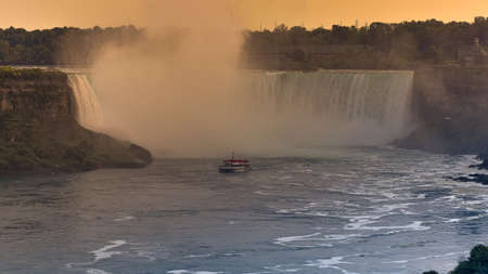 Panorama of the waterfall on the Canadian side at sunset  Concept of nature and travel. Niagara Falls, Canada. United States of Americaの写真素材