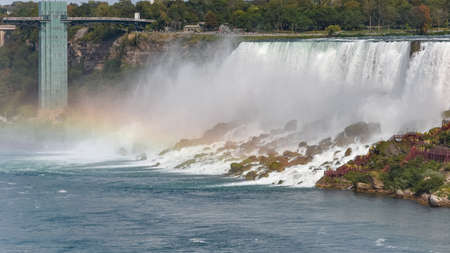 Panorama of the American side of the falls, with rainbow. Concept of travel and tourism. Niagara Falls, Canada. United Statesの写真素材