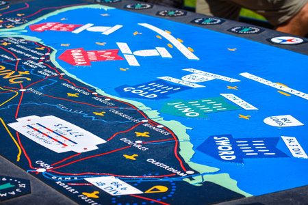 NORMANDY, FRANCE - July 5, 2017: Commemorative plaque with map of the landing beaches, in the...