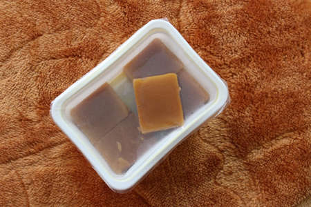Mysore Pak packed inside a plastic boxの写真素材