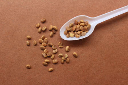 Chironji seeds on brown backgroundの写真素材