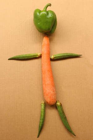 Abstract human figure created with raw vegetablesの写真素材