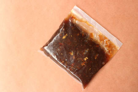 Rose petal jam or gulkand isolated on brown background