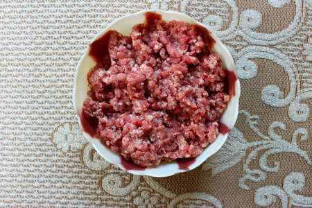 Raw minced mutton in a bowlの写真素材