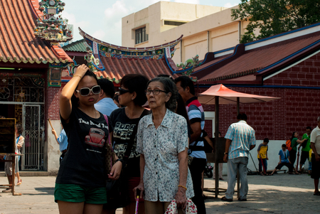 Penang, Malaysia, July 2015 - Family in front of templeのeditorial素材