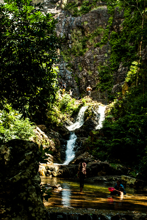 July 2015, Langkawi, Malaysia - Local family at a waterfall