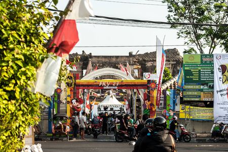 Busy street scene in front of entrance to Taman Sari areaのeditorial素材