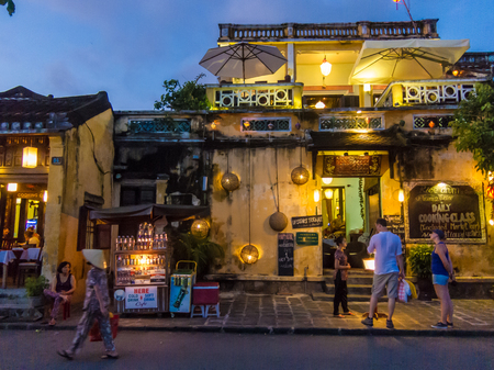 Hoi An, Vietnam - November 8, 2015: Street scene, tourists in front of restaurants, evening lightのeditorial素材