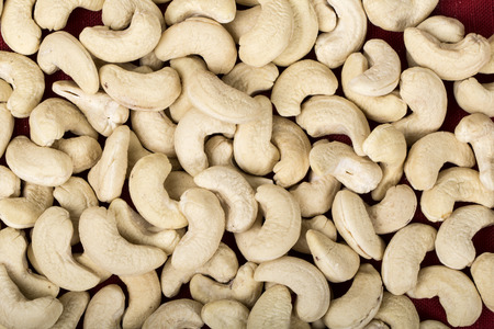 Cashew nuts in bowl on wood tableの写真素材