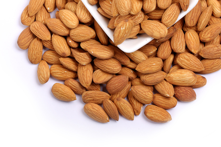 Almonds isolated. Group of almond nuts isolated on white background. Full depth of fieldの写真素材
