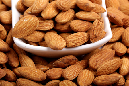 Almonds isolated. Group of almond nuts isolated on white background. Full depth of fieldの写真素材