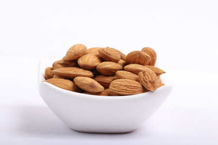 Almonds isolated. Group of almond nuts isolated on white background. Full depth of fieldの写真素材