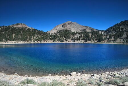 Crystal clear lake in Lassen Volcanic National Park in Californiaの写真素材