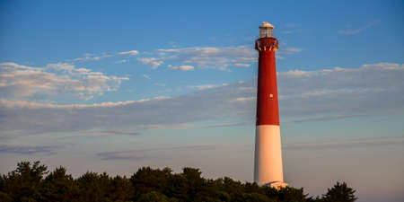 lighthouse against a blue sky backgroundの写真素材