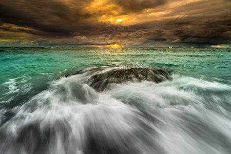 Beautiful sunset and big waves, world-class surfing spots at tugis beach, Mentawai. There is a big...