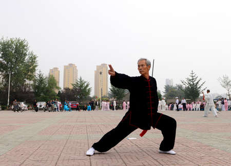 Luannan - September 20: an old man fencing in cultural activities square, the performance on...