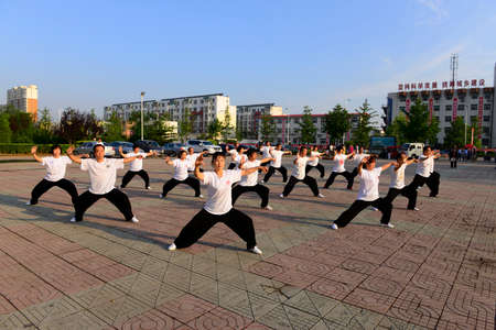 Luannan - June 14: square in the center of the literary style taijiquan collective performance, June 14, 2014, luannan county, hebei province, China.のeditorial素材