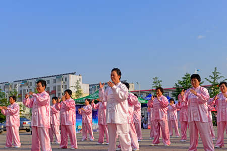 Luannan - June 14: square in the center of the literary style taijiquan collective performance, June 14, 2014, luannan county, hebei province, China.のeditorial素材