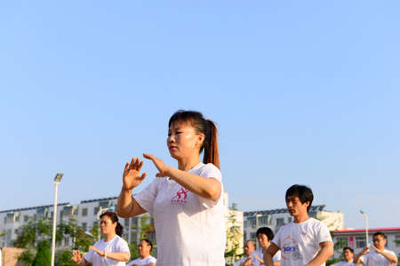 Luannan - June 14: taijiquan woman individual performances of close-up square in the center of the literary style, June 14, 2014, luannan county, hebei province, China.のeditorial素材