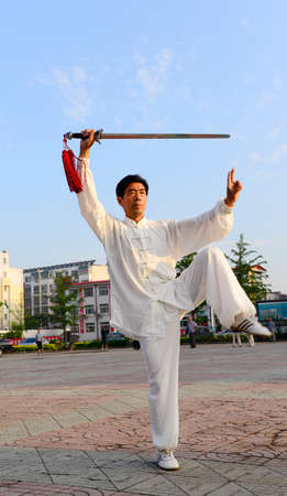 LUANNAN - JUNE 14: square in the center of the literary style men's fencing individual performances, June 14, 2014, luannan county, hebei province, China.のeditorial素材