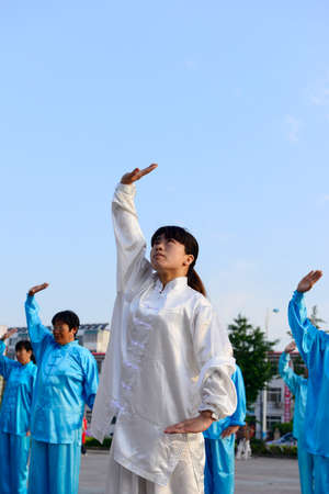 Luannan - June 14: taijiquan woman individual performances of close-up square in the center of the literary style, June 14, 2014, luannan county, hebei province, China.のeditorial素材