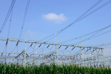 High voltage towers in the fields