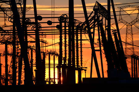 High voltage power grid, in the sunsetの写真素材