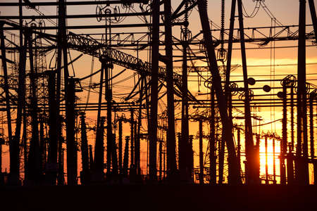 High voltage power grid, in the sunsetの写真素材