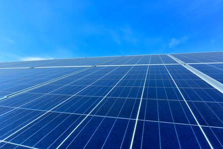 Solar power equipment under the blue skyの写真素材