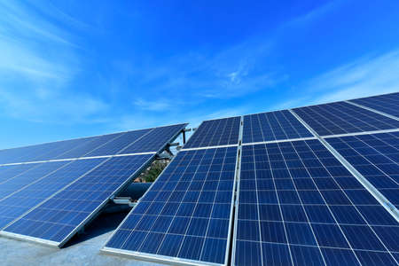 Solar power equipment under the blue skyの写真素材