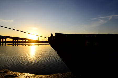 The fishing boat on river in the eveningの写真素材
