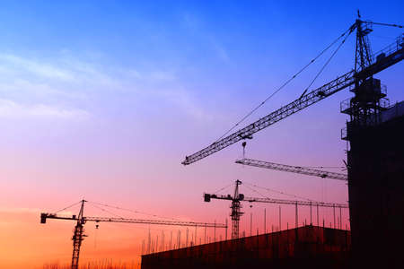 Tower crane work in the evening on the construction siteのeditorial素材
