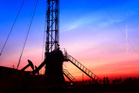 The pumping unit is working in the setting sun 
