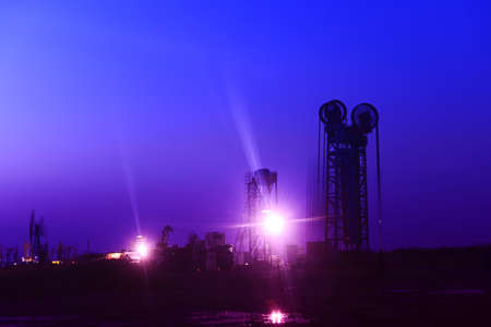 The pumping unit is working in the setting sun 