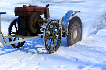 worker cutting the iceの写真素材