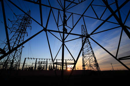 A high voltage substation in the sky at sunrise