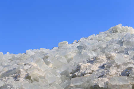 Lots of ice stacked together, outdoorsの写真素材