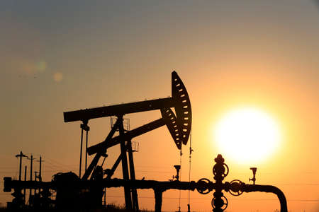 The pumping unit is working in the setting sun