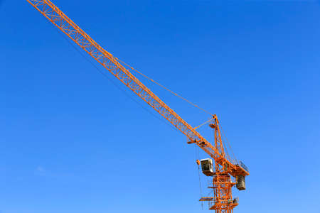 The crane is working at the construction siteのeditorial素材